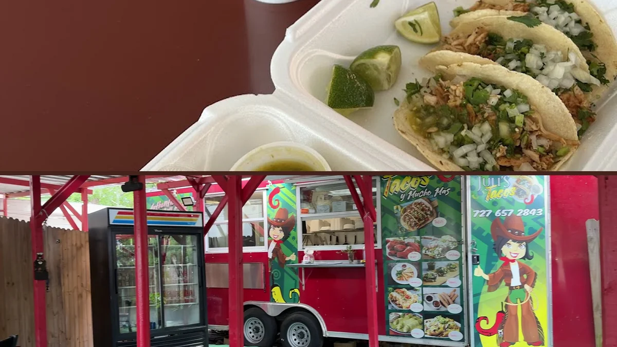 Tacos and sides on a simple table.